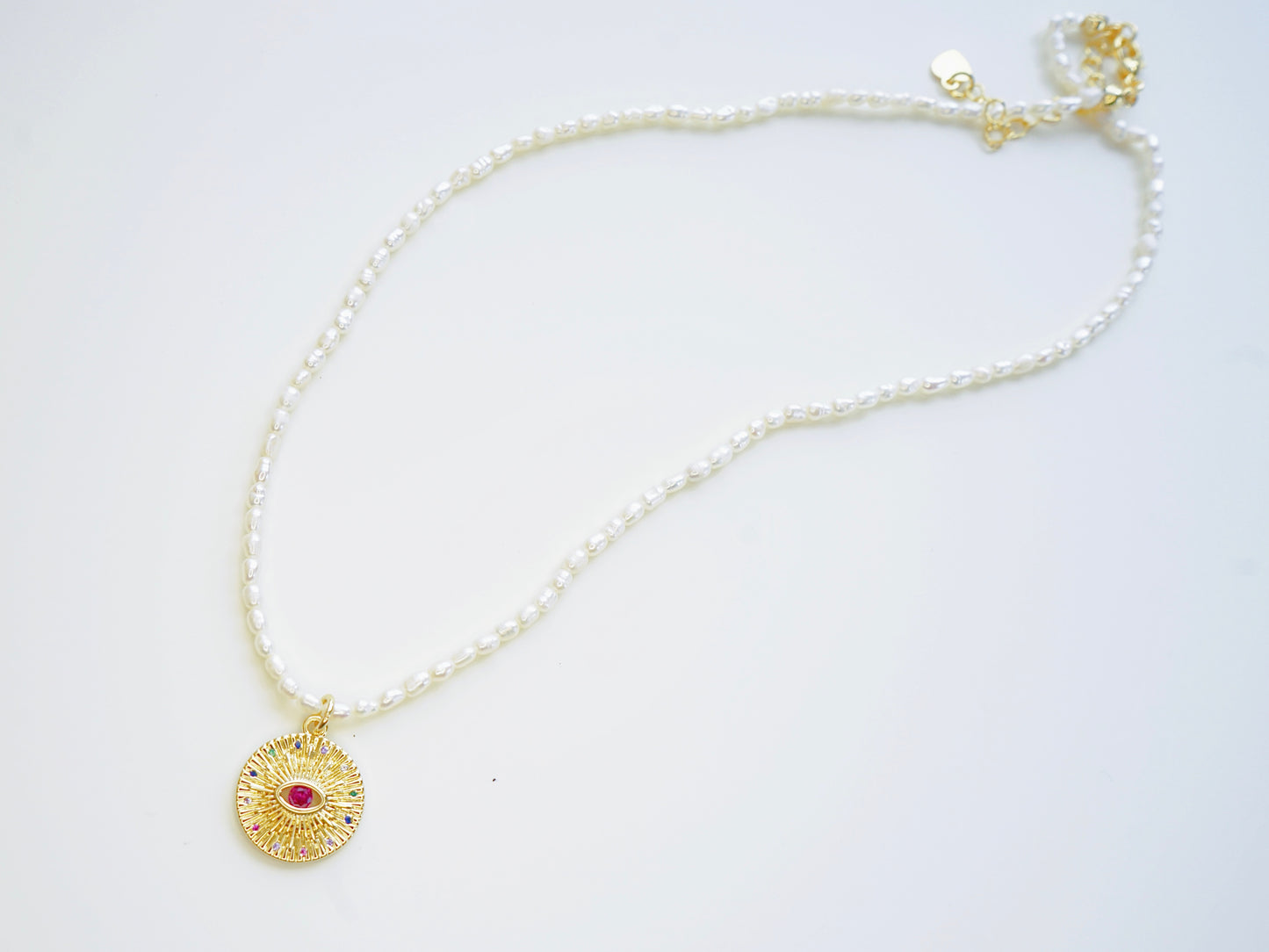 Radiant Eye Pearl Necklace