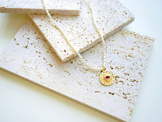 Radiant Eye Pearl Necklace